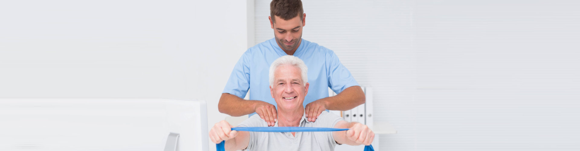 caregiver giving a back massage on a senior man